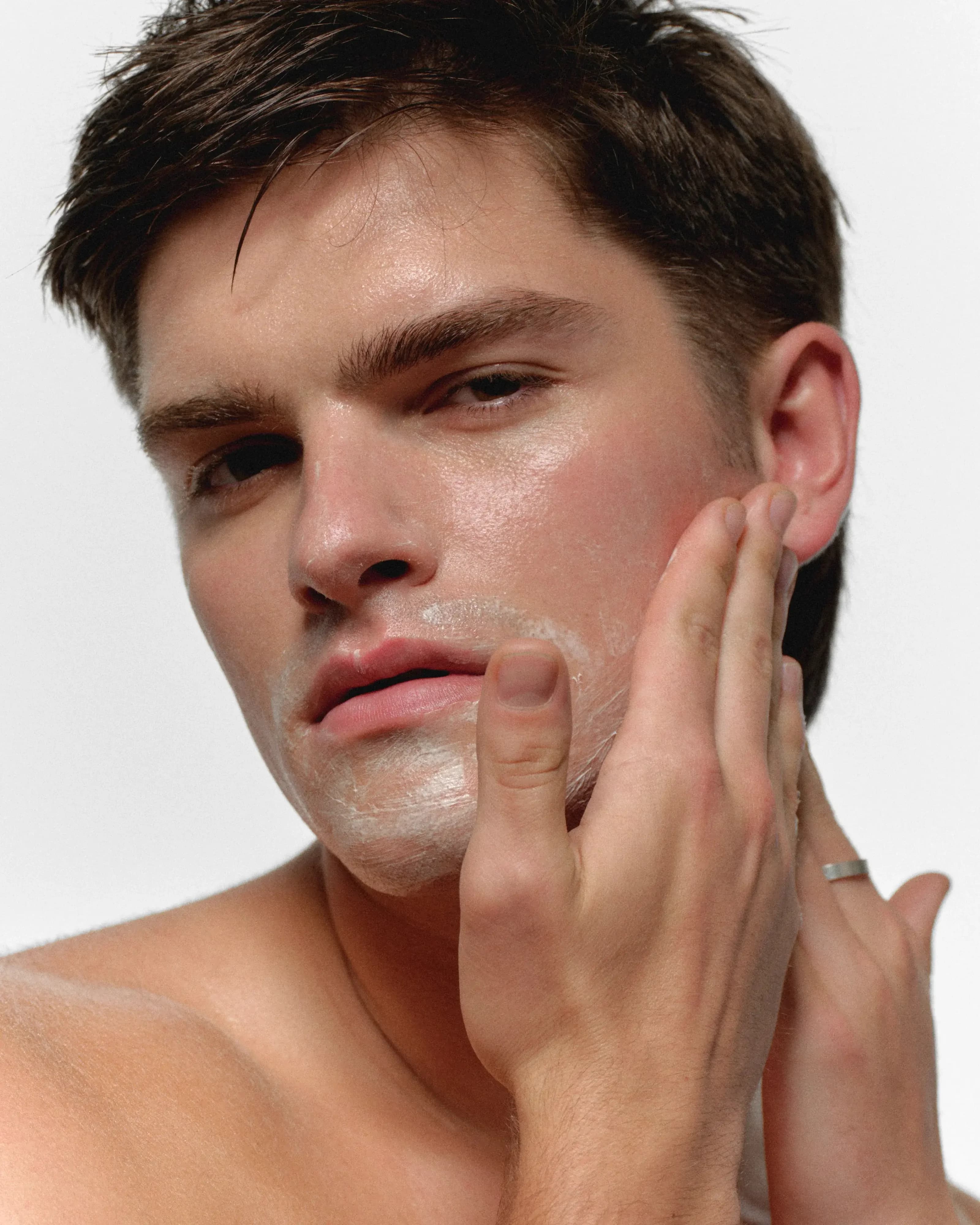Man with healthy, confident skin using RAWDOG skincare