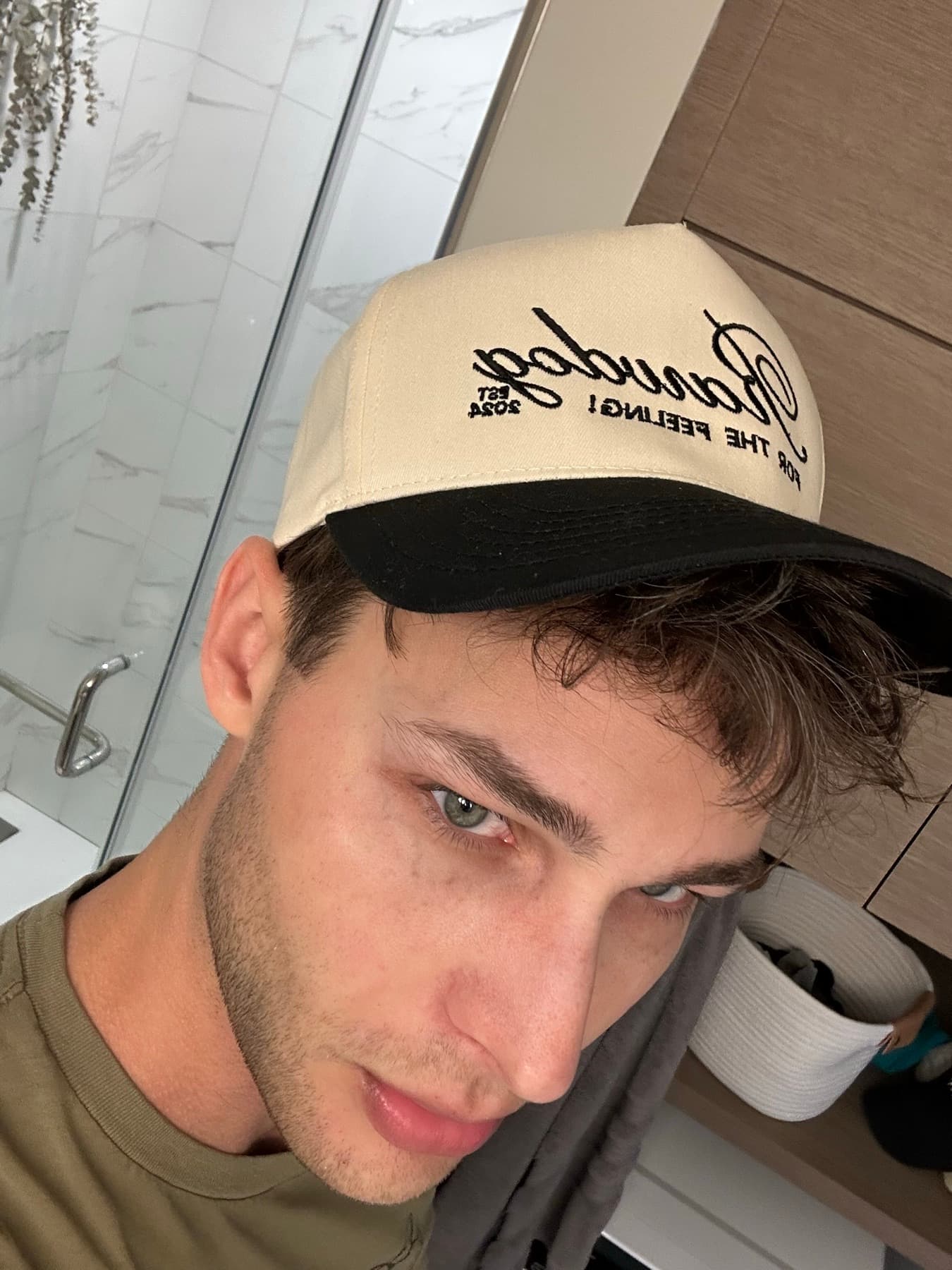 RAWDOG community member wearing the trucker hat in a selfie