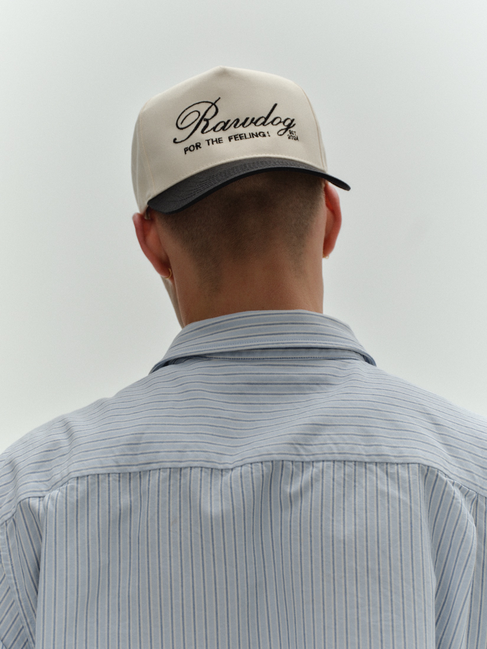 Model wearing the RAWDOG Trucker Hat from behind